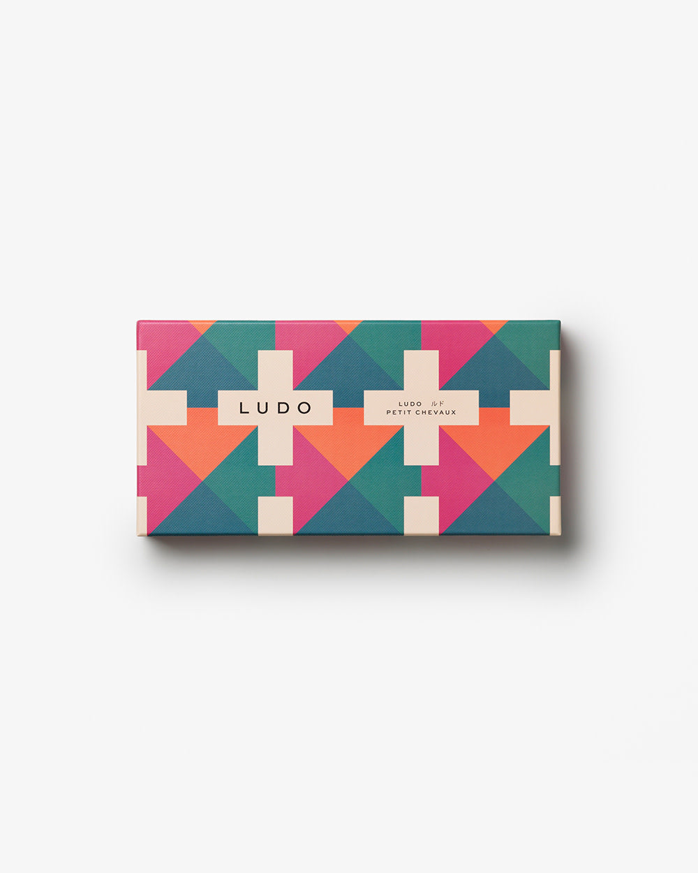 Closed Ludo box with pink, teal, and orange pattern