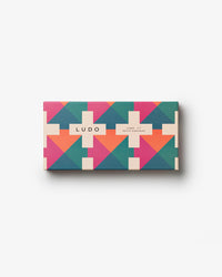 Closed Ludo box with pink, teal, and orange pattern