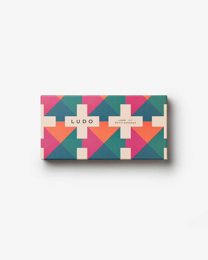 Closed Ludo box with pink, teal, and orange pattern