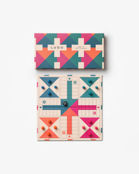 Top-down view of colourful Ludo set with matching box