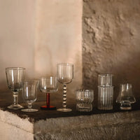 Luna wine glasses and glassware by Olsson & Jensen styled on a stone ledge