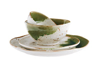collection of white and green stoneware plates, bowls, and mugs for a cohesive table
