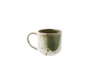 white and green stoneware mug with unique reactive glaze finish
