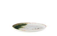 close-up of white and green stoneware lunch plate in a modern Nordic table setting
