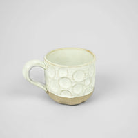 Maja white textured ceramic mug with reactive glaze by Olsson & Jensen