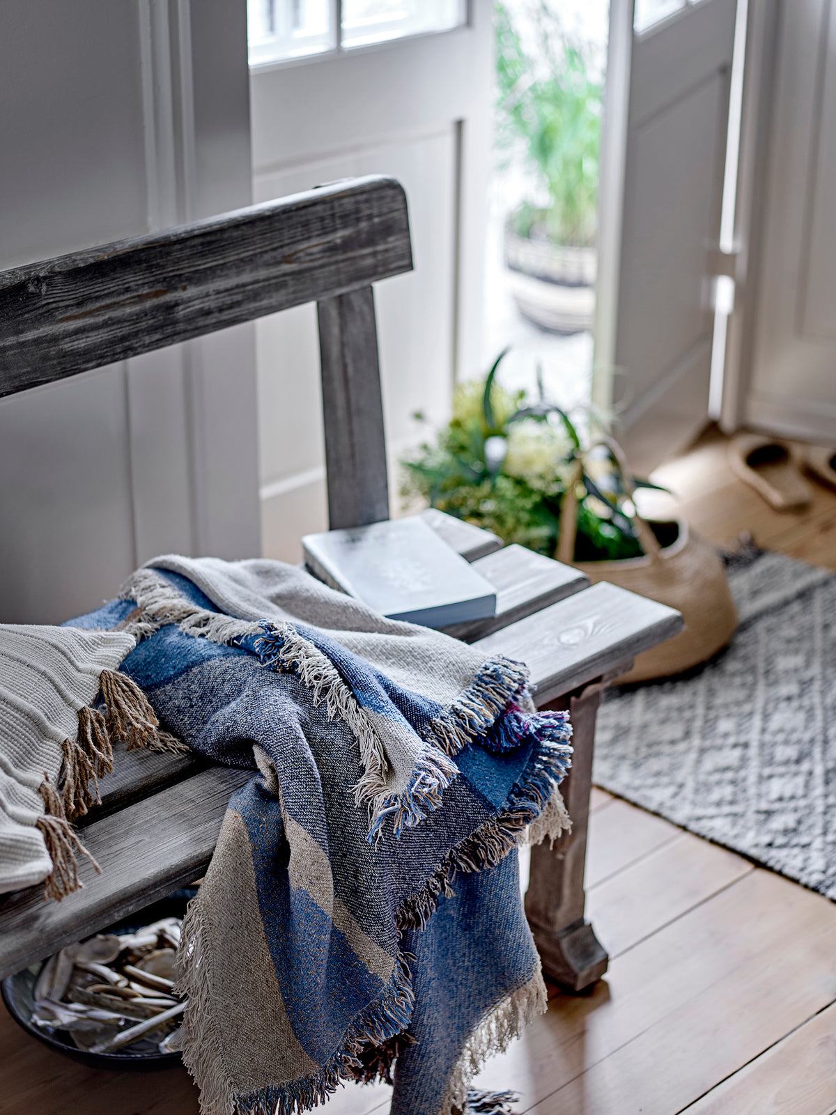 Maji Throw – Blue by Creative Collection styled on bench