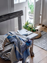 Maji Throw – Blue by Creative Collection styled on bench