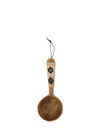 hand-carved mango wood serving spoon with woven bamboo handle and hanging leather loop