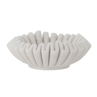 side view of white decorative wave form marble bowl
