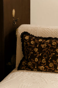 Maribel floral velvet cushion by Olsson & Jensen on a cream boucle sofa