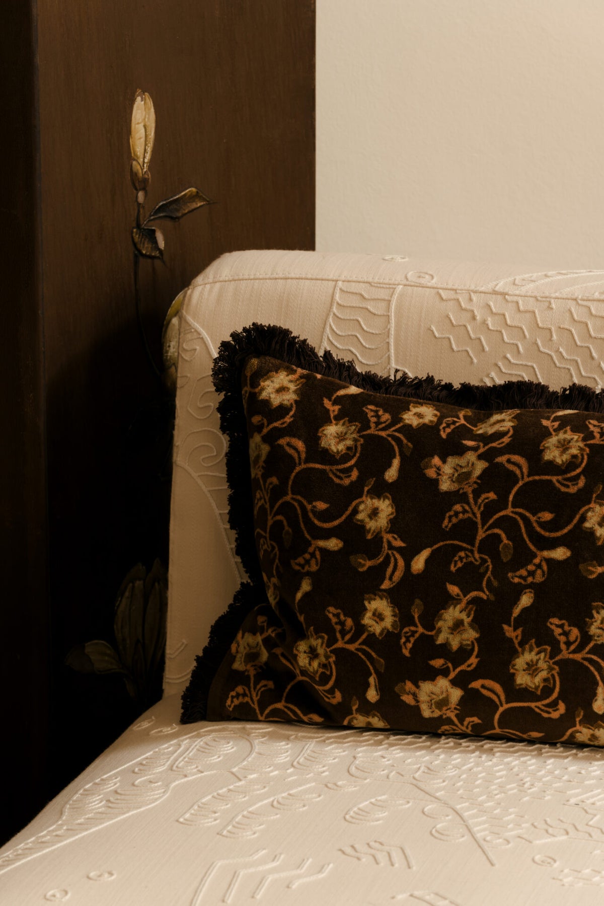 Maribel floral velvet cushion by Olsson & Jensen on a cream boucle sofa