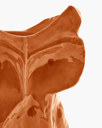 Close-up of Marni x Serax small orange owl vase with bold glossy finish