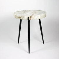 Side view of the Marwin white and sand marble side table by Olsson & Jensen