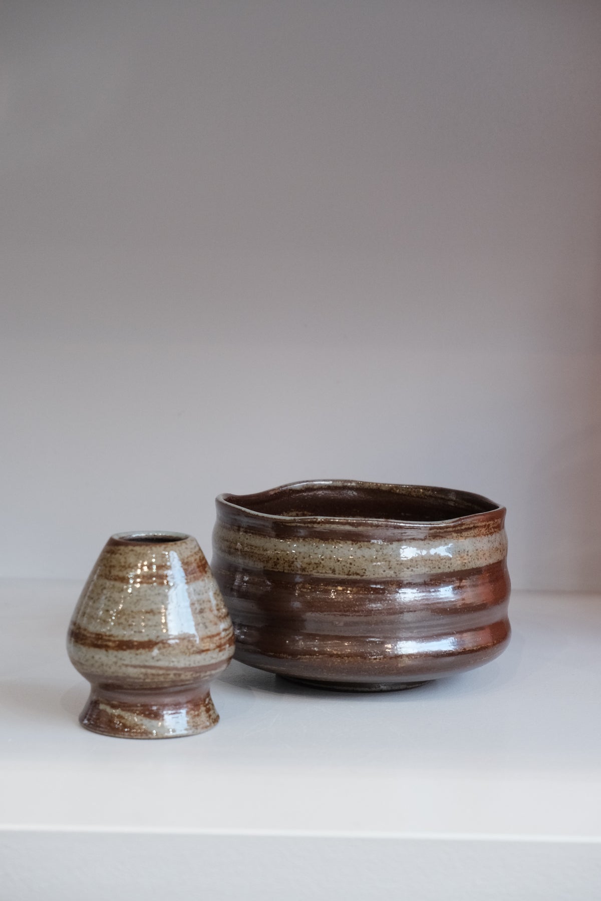 stoneware matcha bowls in multiple earthy colourways displayed together
