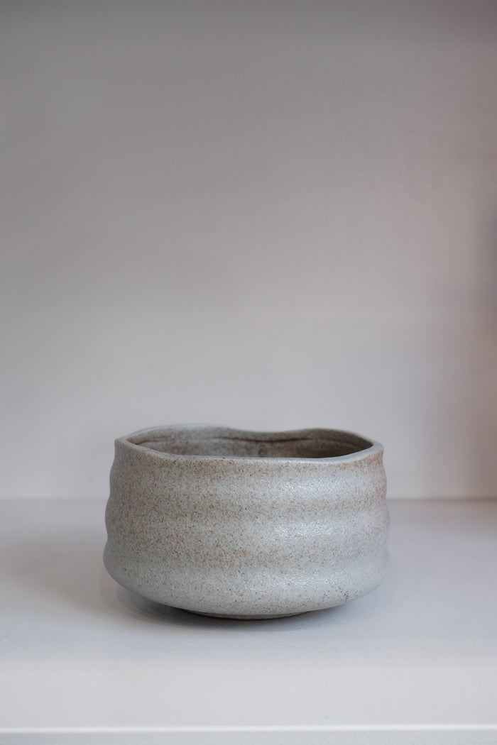 handmade pebble matcha bowl in grey stoneware with subtle brown speckling
