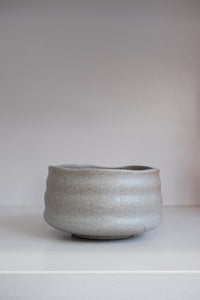 grey stoneware matcha bowl showing brown speckles and organic handmade texture
