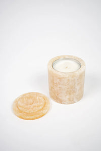 Mauro beige marble scented candle with the lid removed by Olsson & Jensen