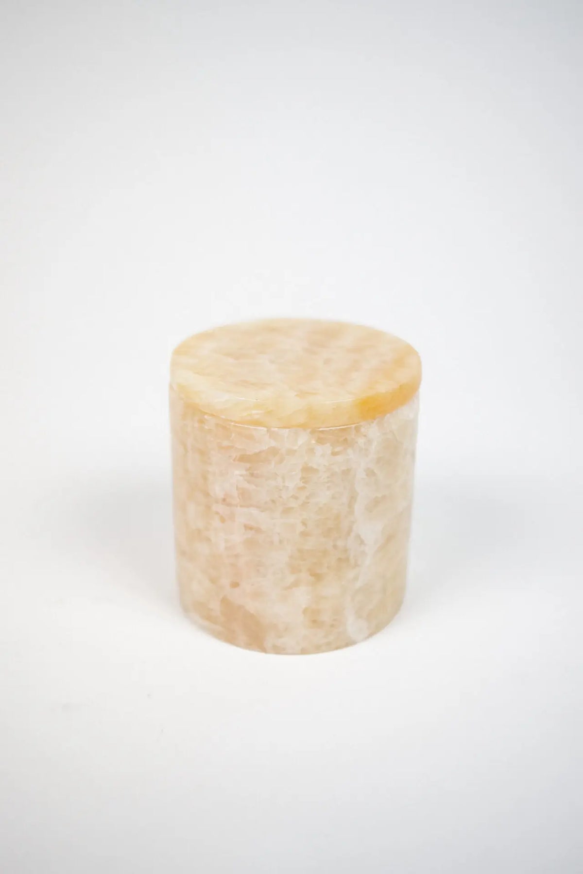 Mauro cashmere candle in a beige marble holder by Olsson & Jensen