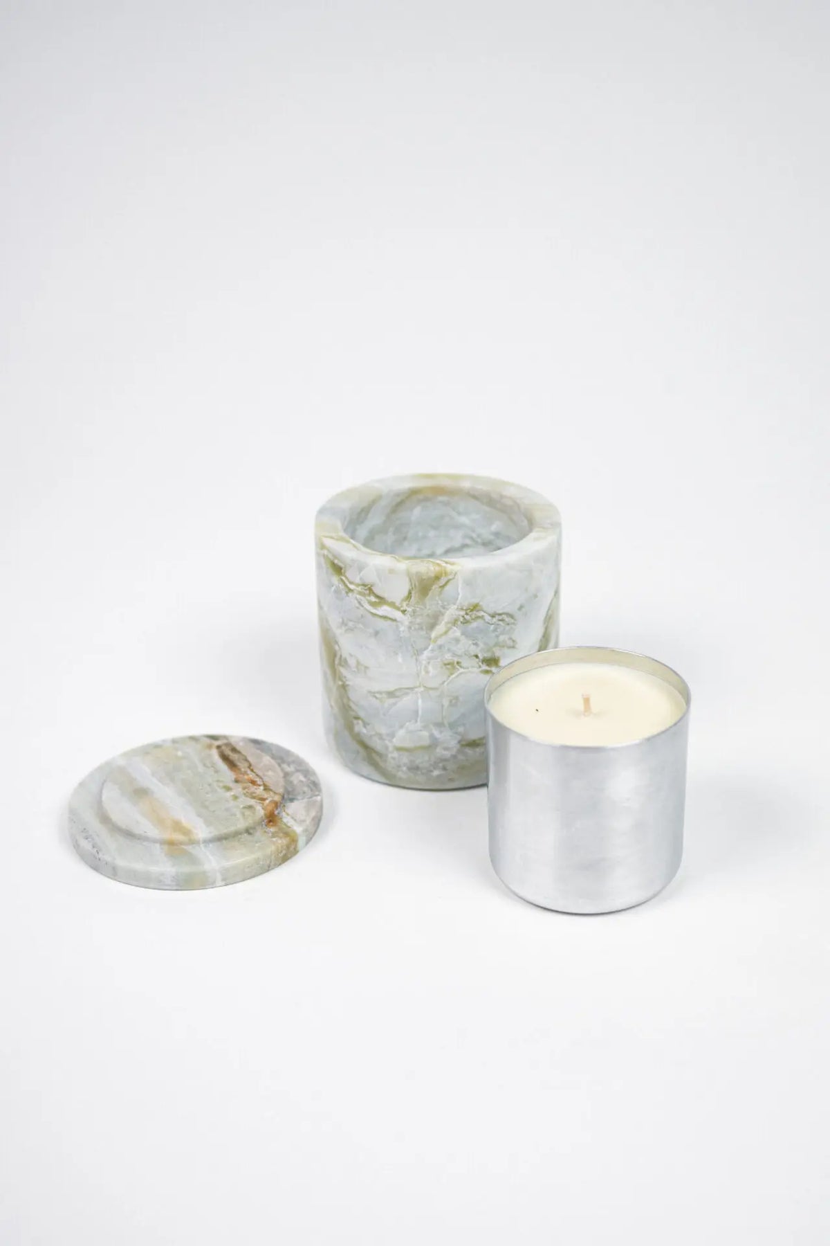Mauro green marble candle with its lid and metal refill by Olsson & Jensen