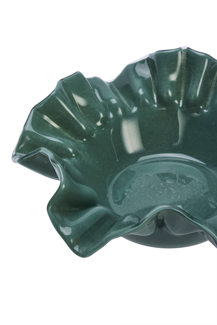 close-up of deep green ruffled glass bowl showing wavy edge
