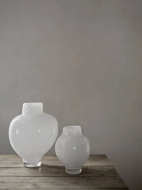 Mila white glass vases by Olsson & Jensen styled on a rustic wooden table