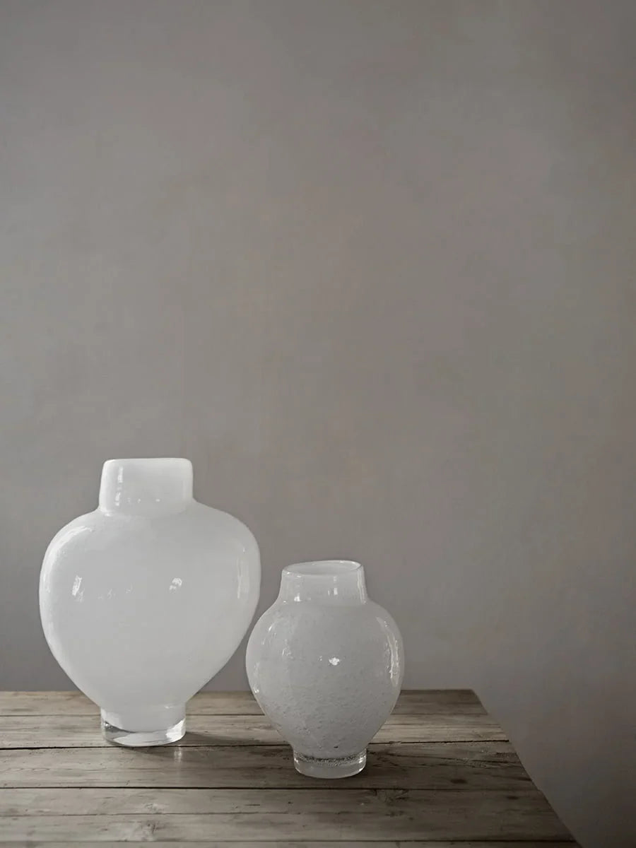 Mila white glass vases by Olsson & Jensen styled on a rustic wooden table