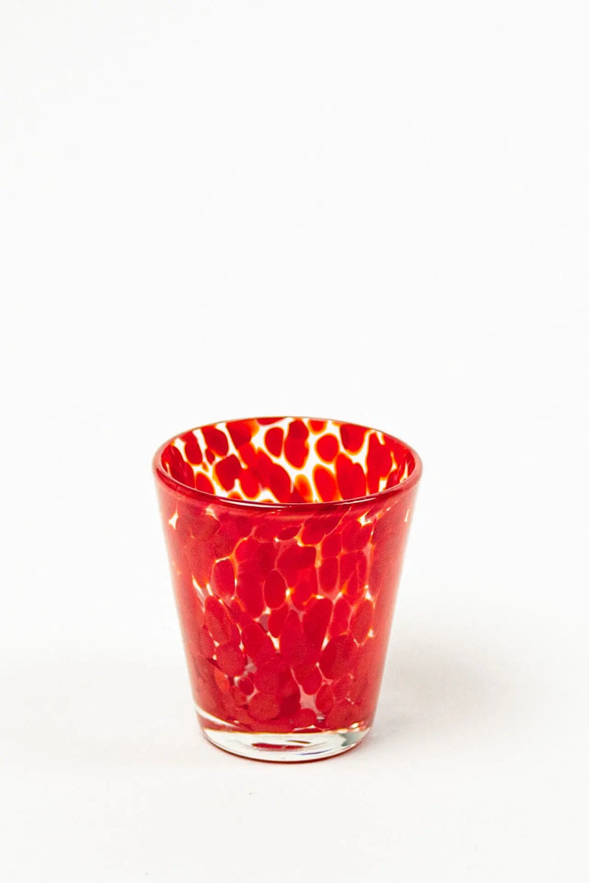 Milano red speckled hand-blown drinking glass by Olsson & Jensen on a white background