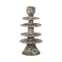 Milo candle holder from the side, showing its irregular stacked discs
