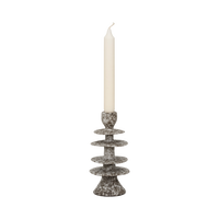 Milo candle holder with an ivory dinner candle