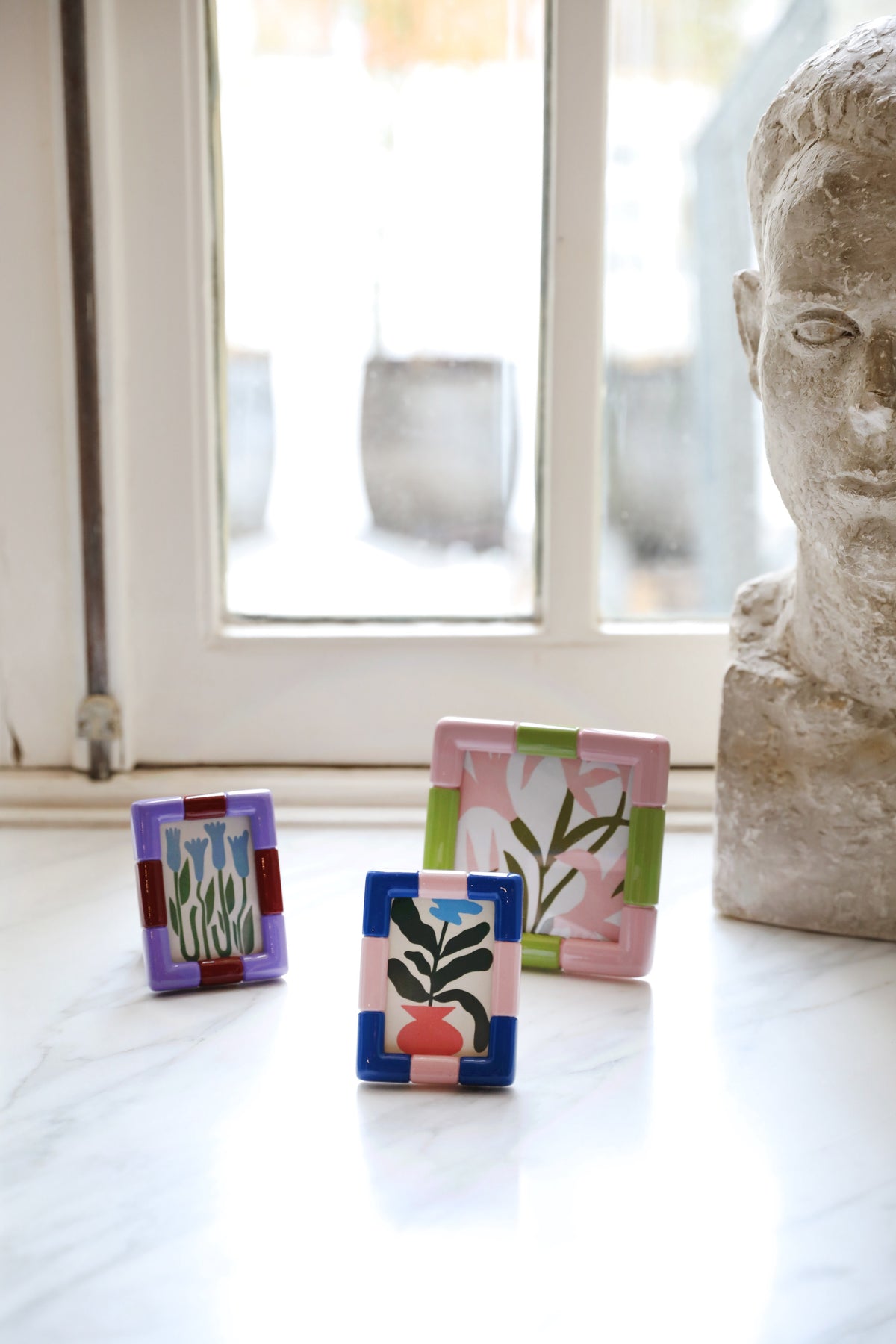 Mix-and-match collection of &Klevering Rift frames styled together for an eclectic display.
