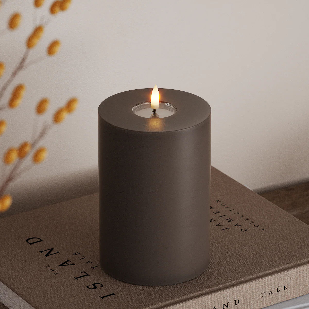 large mocha LED candle with realistic flame styled on coffee table for autumn ambience
