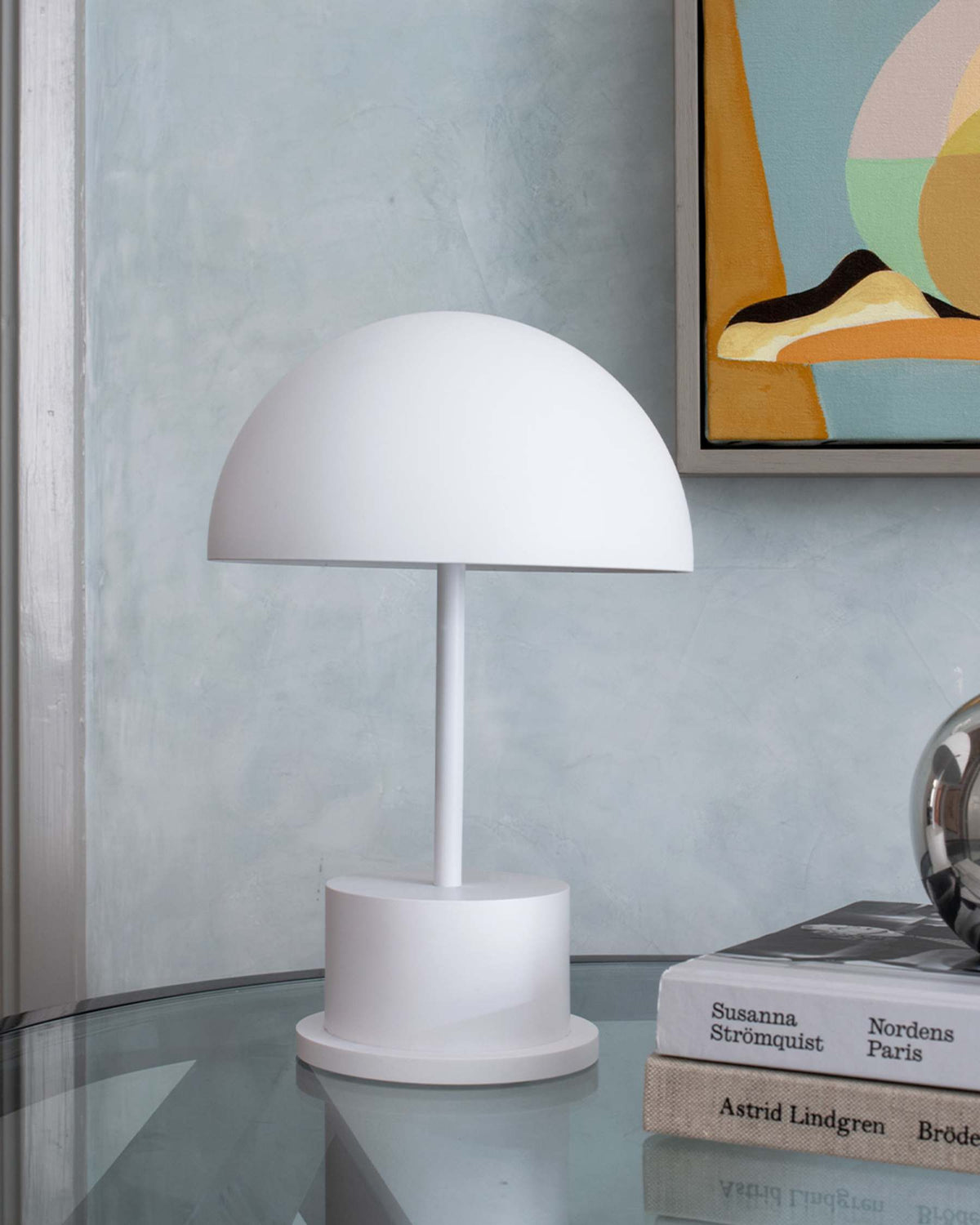 minimalist white rechargeable lamp styled in a modern living room