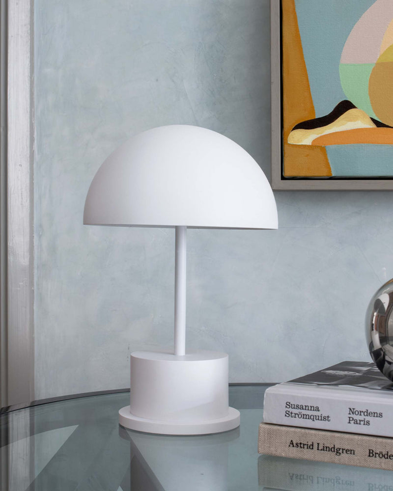 minimalist white rechargeable lamp styled in a modern living room