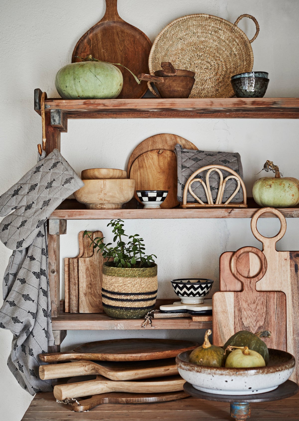stoneware serving bowl displayed on wooden kitchen shelves with natural decor
