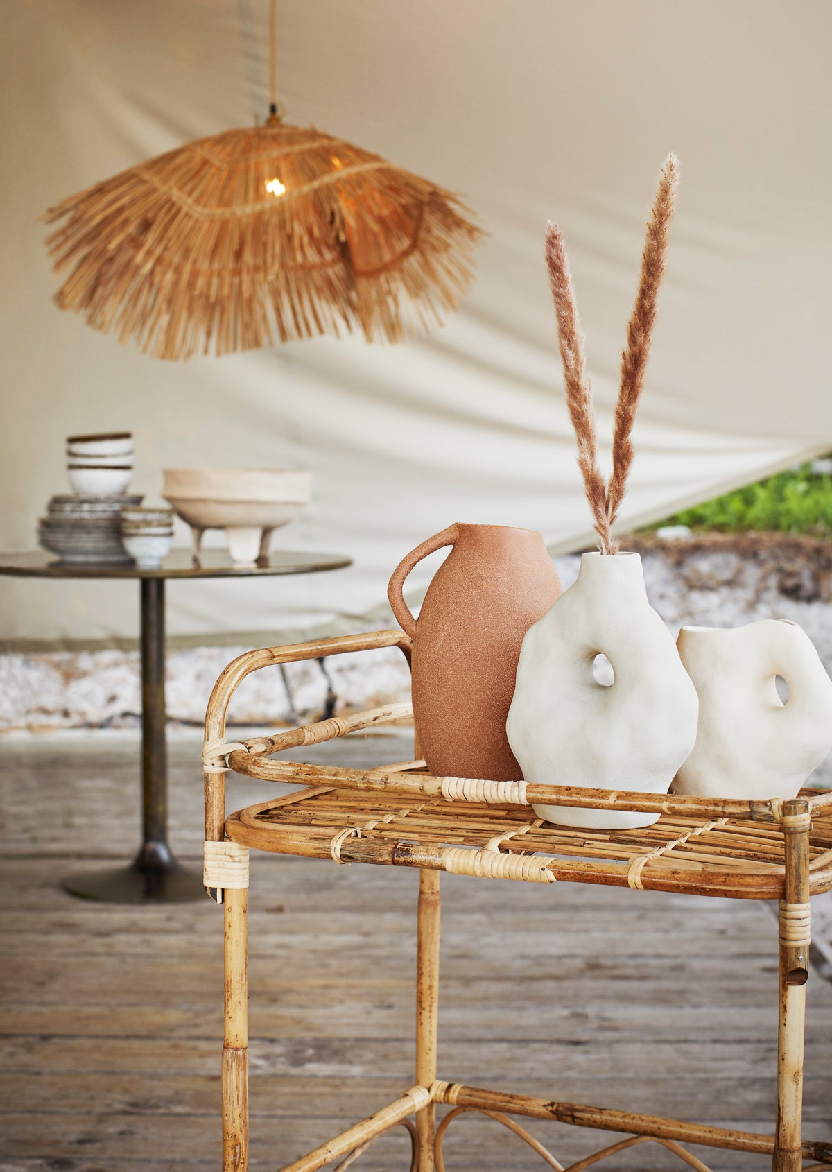 small reactive glaze stoneware bowl filled with fresh herbs on woven placemat
