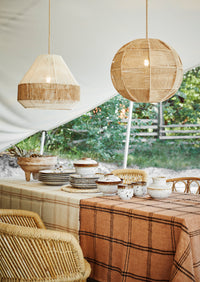 white and brown reactive glaze stoneware tableware set styled on outdoor table
