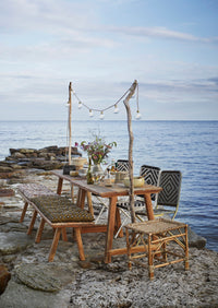 clear cut glass wine glasses on an outdoor table by the sea
