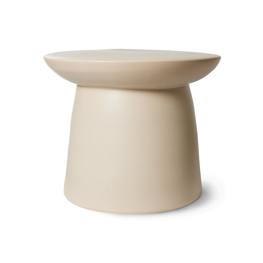 side view of a generously proportioned  cream white stoneware end table