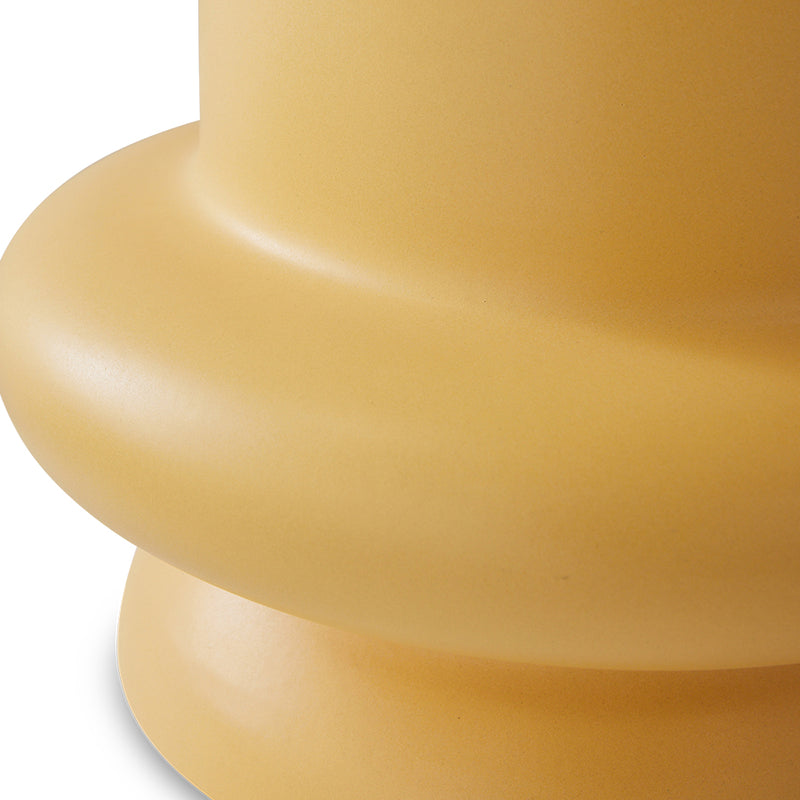 close up of the smooth finish to an hkliving accent table in honey collour and with generous curves