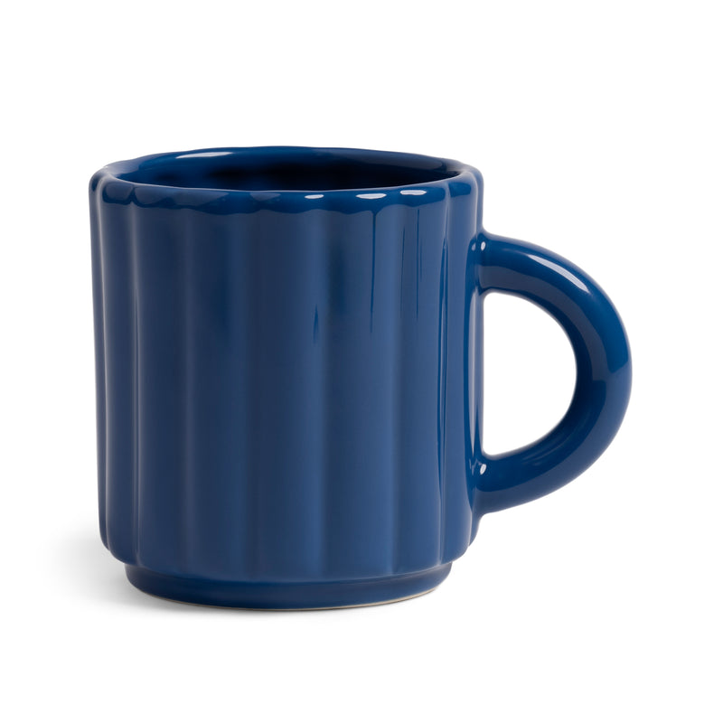 Blue ribbed mug on a white background by &klevering