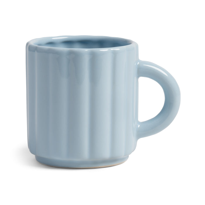Light blue ribbed ceramic mug on a white background by &klevering