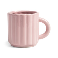 Light pink ribbed mug on a white background by &klevering