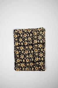 Nadine black floral block print cotton kitchen towel by Olsson & Jensen, folded