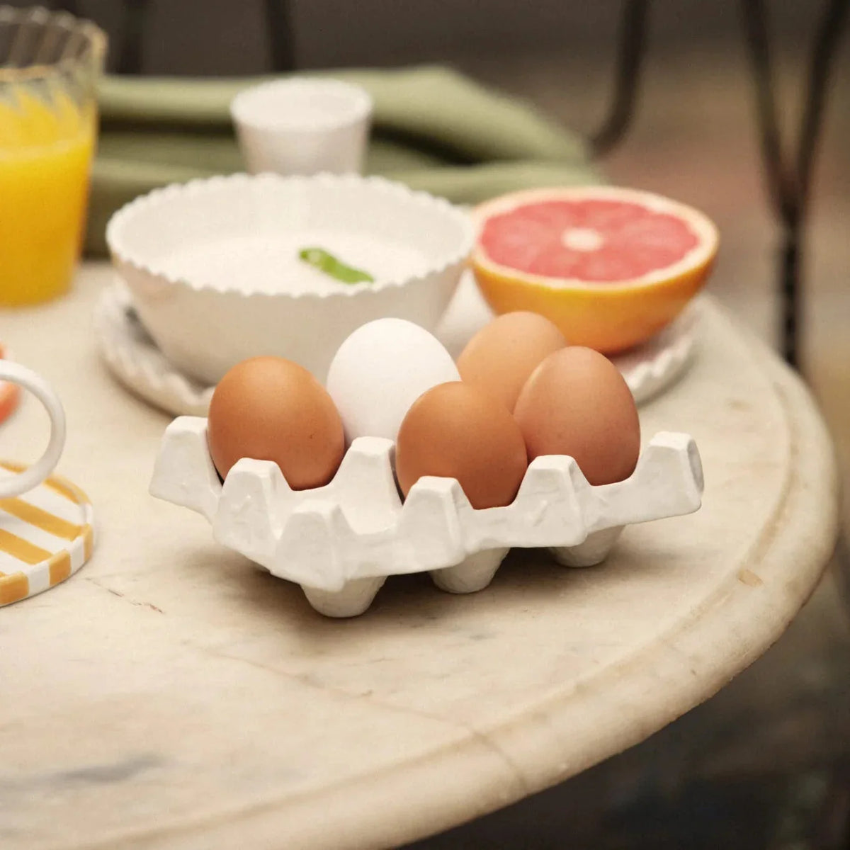 Nea egg tray with eggs by Olsson & Jensen on a breakfast table