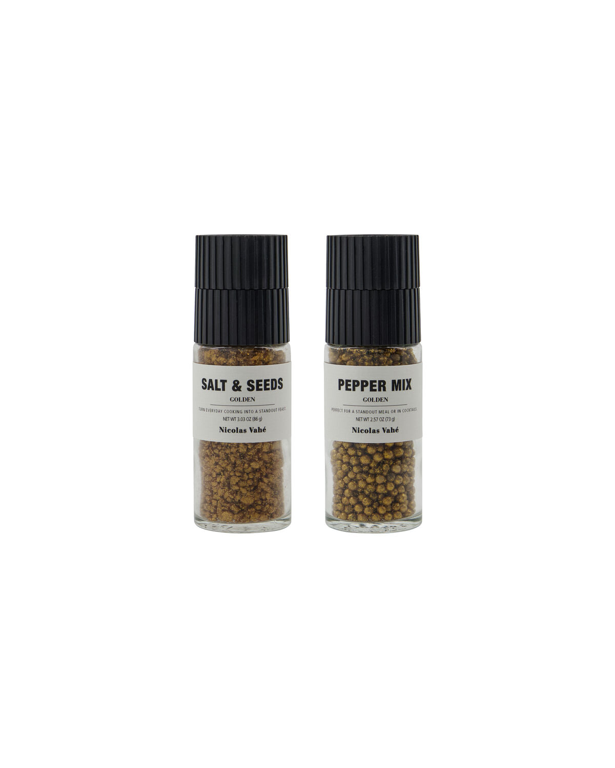 Nicolas Vahé golden salt and seeds grinder next to a golden pepper mix grinder