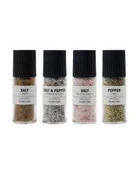 Four Nicolas Vahé grinders: smoked salt, salt and pepper with truffle, white wine and shallot salt, and garlic pepper