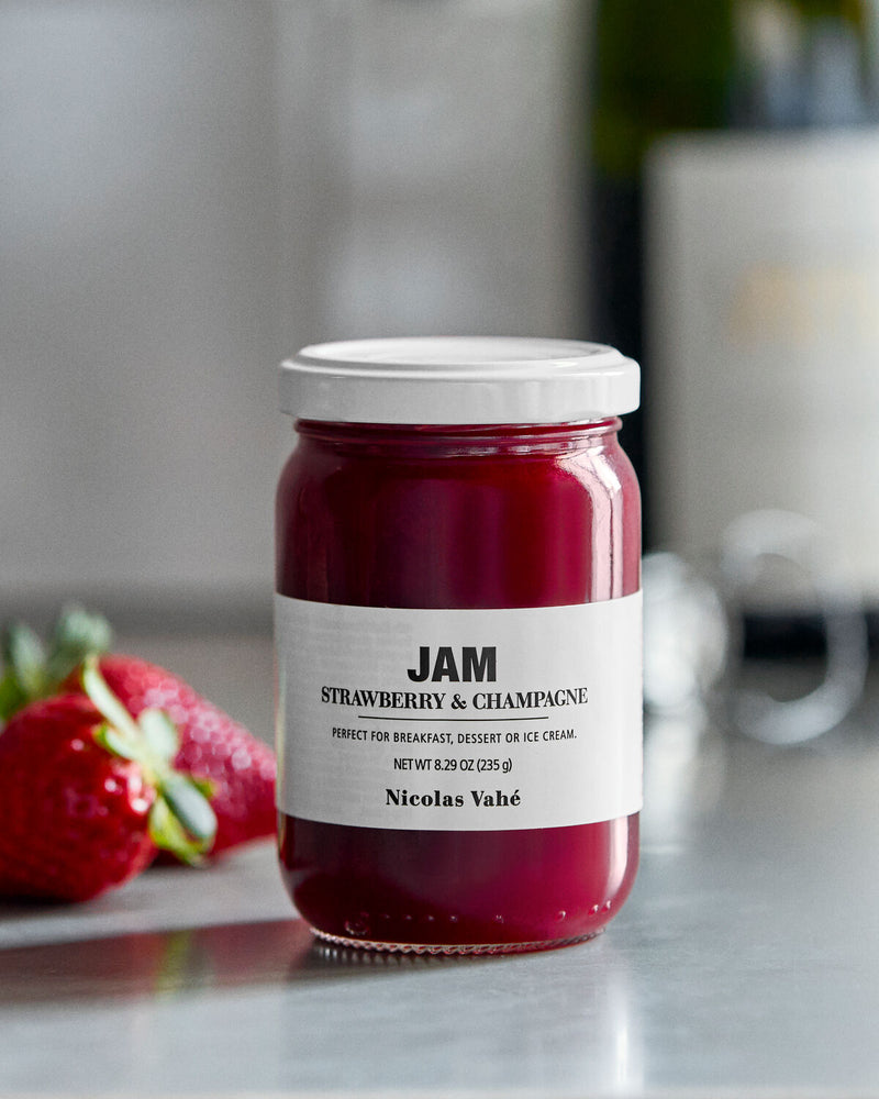 Nicolas Vahé strawberry and champagne jam on a kitchen worktop with fresh strawberries
