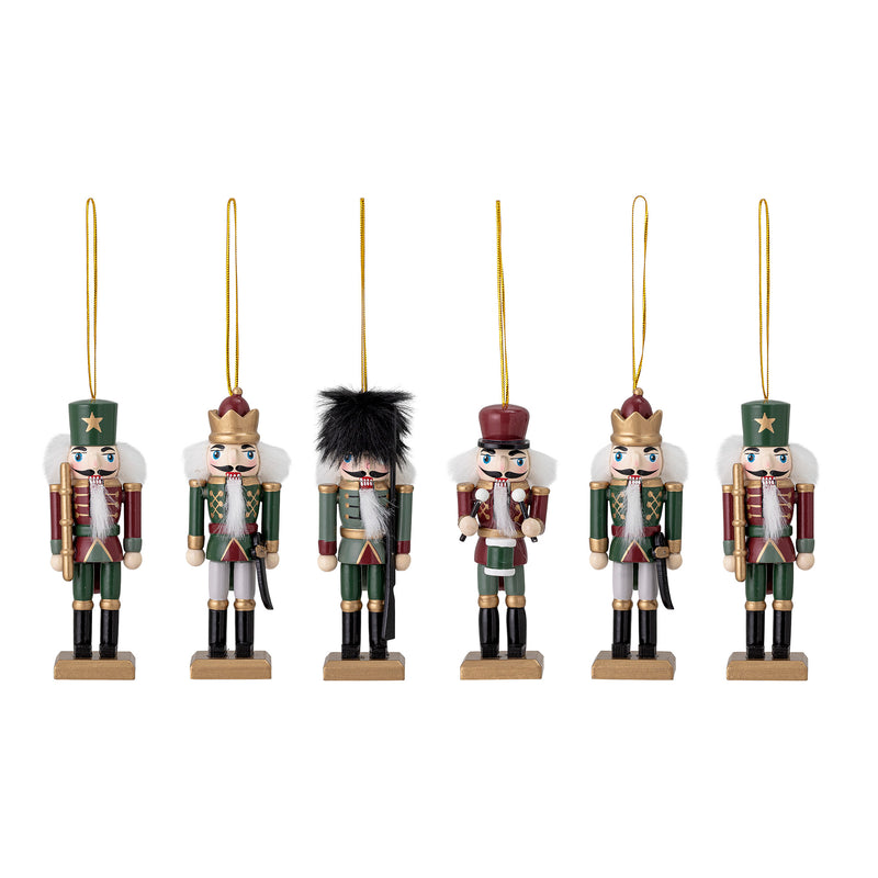 Six hand-painted wooden nutcracker Christmas ornaments in green, red, and gold