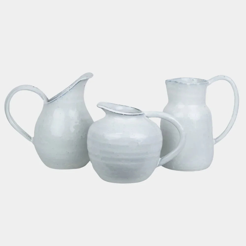 Group of white glazed Noelle jugs by Olsson & Jensen