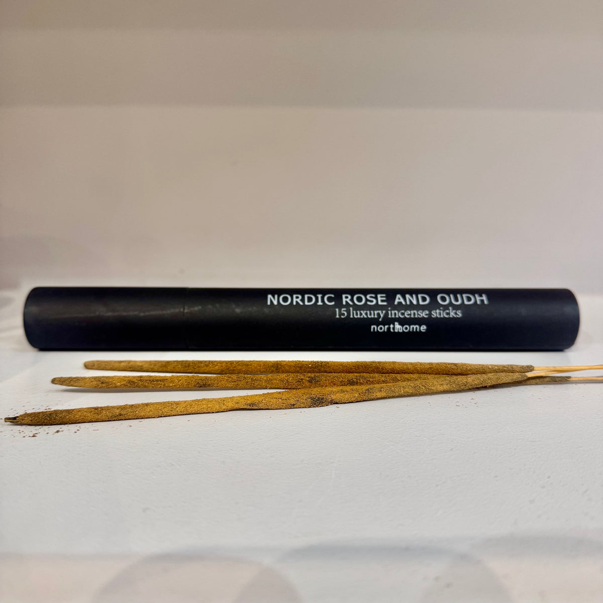 Nordic Rose and Oudh luxury incense sticks with black tube packaging by North Home
